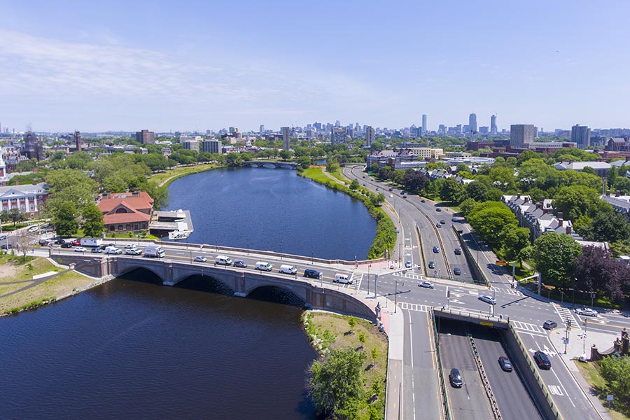 Medford, MA Insurance - Aerial View of the Charles River and Surrounding Suburbs and Highways With Boston in the Distance